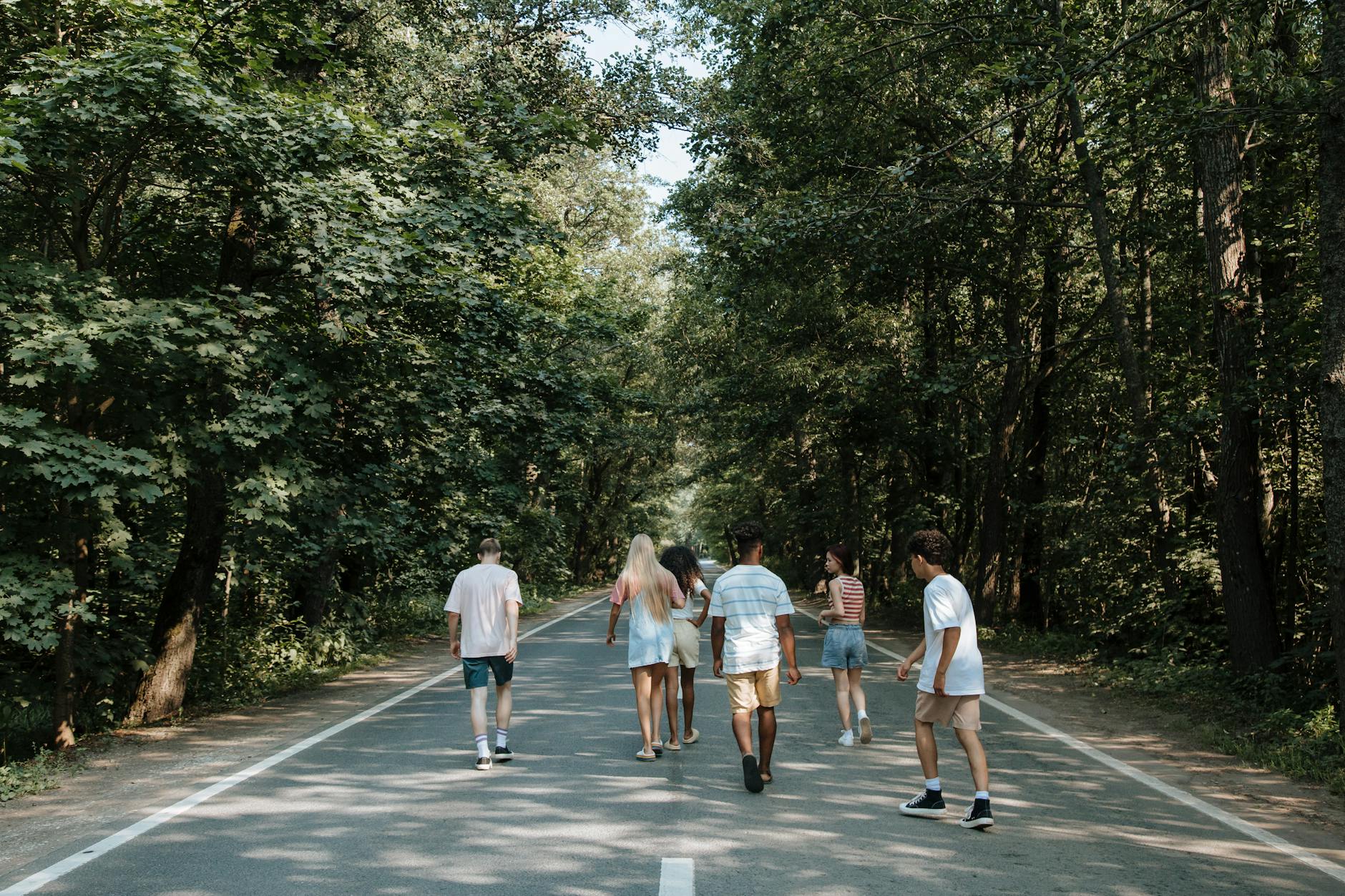 friends walking on the road