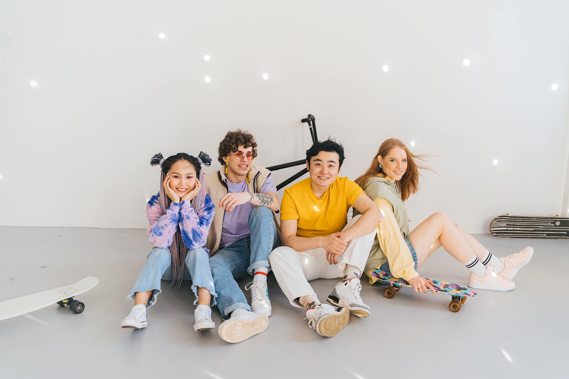 a group of people smiling while sitting on the floor