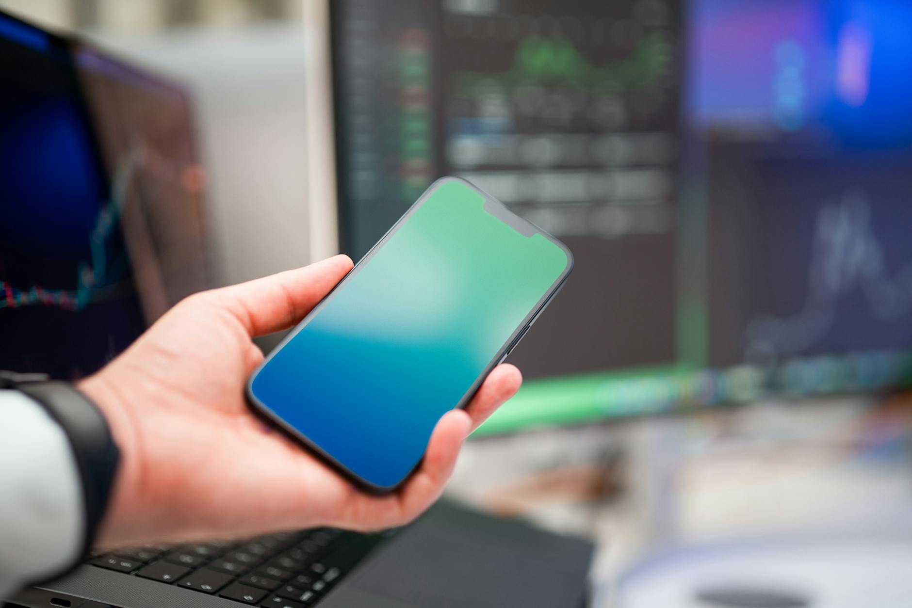 businessman holding blank screen smartphone